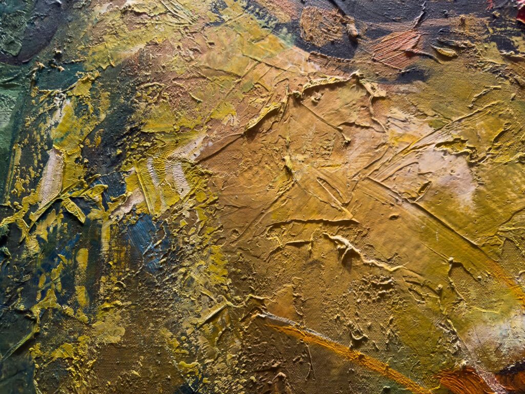 Close view of a painting in ochre and olive with heavy palette-knife texture
