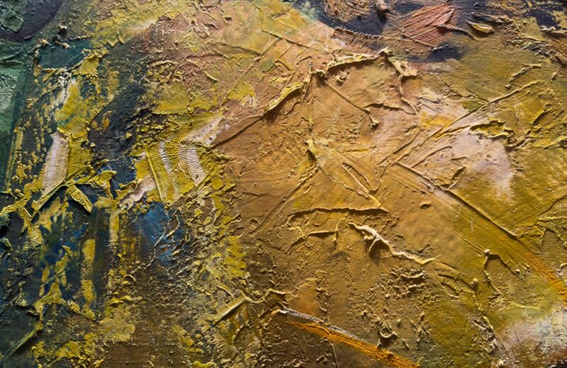 Close view of a painting in ochre and olive with heavy palette-knife texture