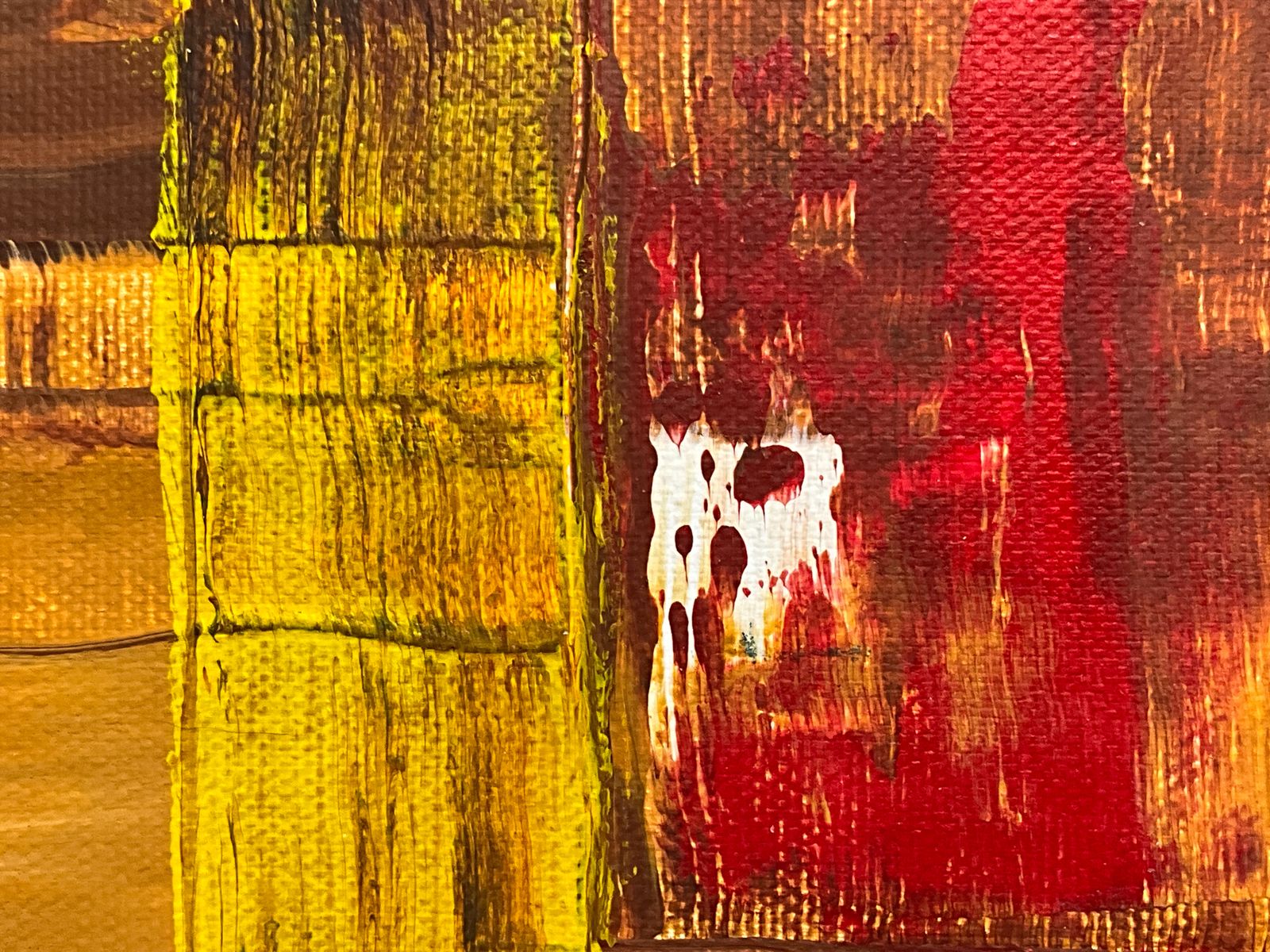Painting in blocks of yellow ochre and red with a scraped texture