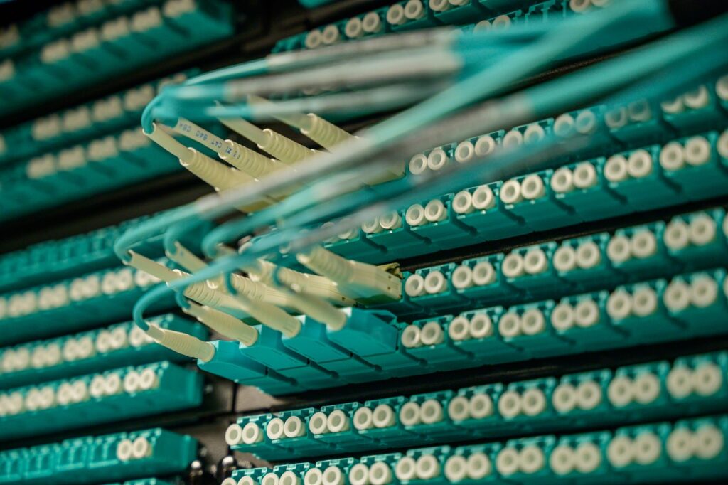 Fibre optic patch cables connected to a server rack