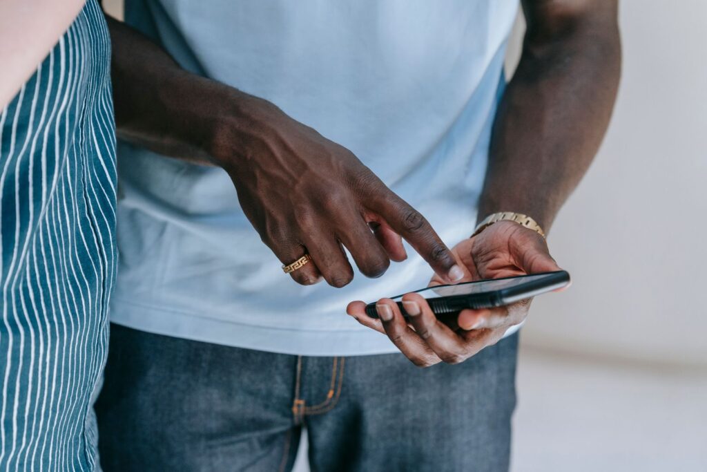Close view of a person using a smartphone indoors