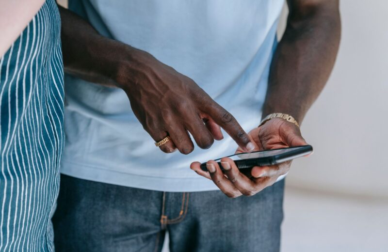 Close view of a person using a smartphone indoors