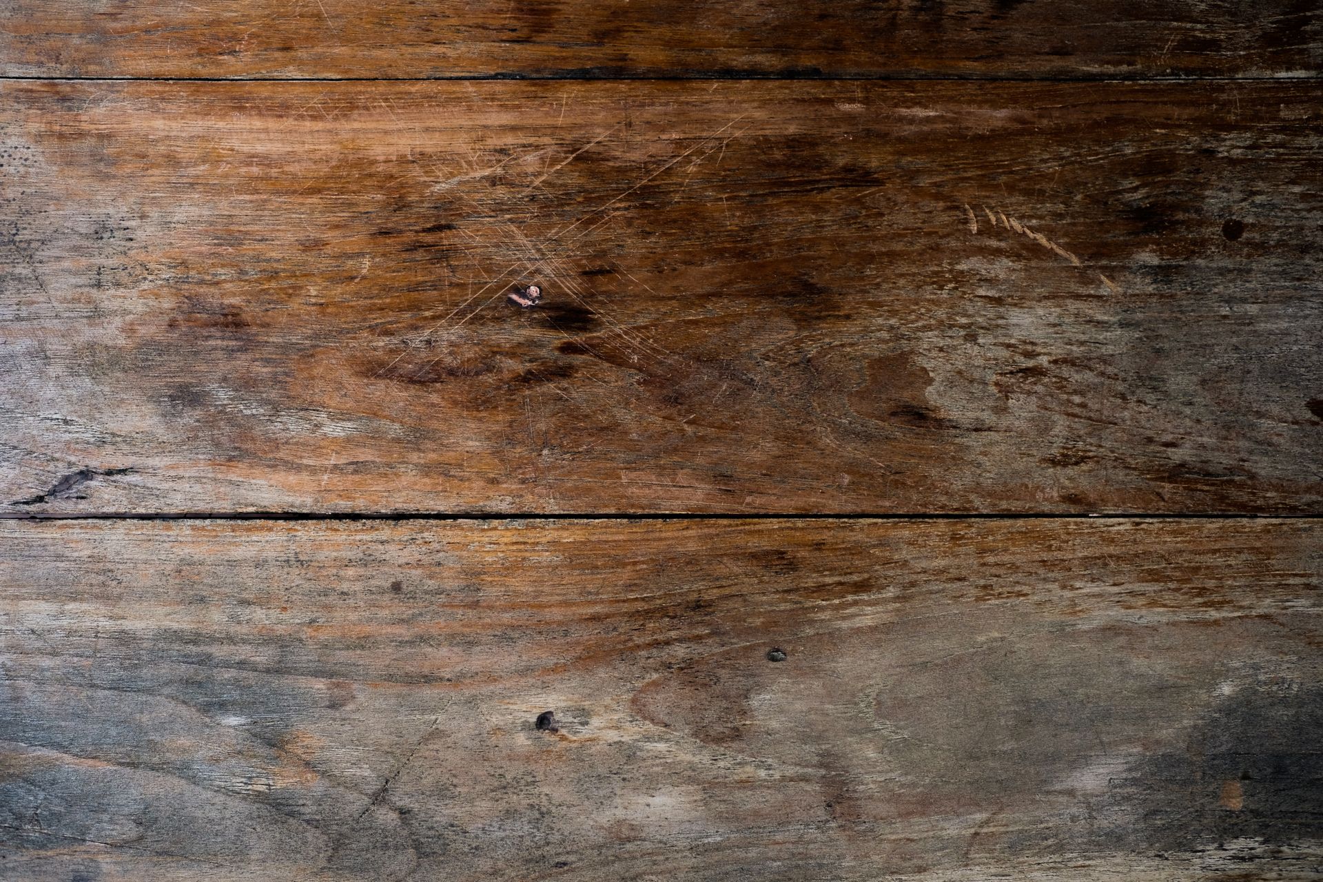 Dark weathered wooden planks seen from above