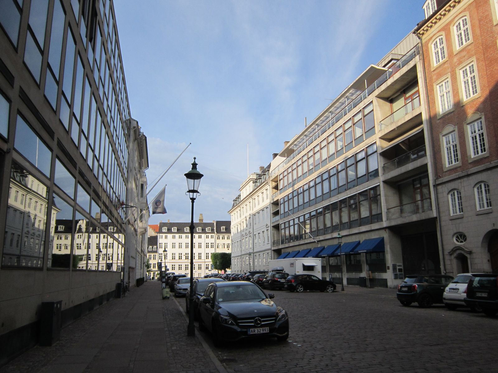 A quiet street of older office buildings in the morning