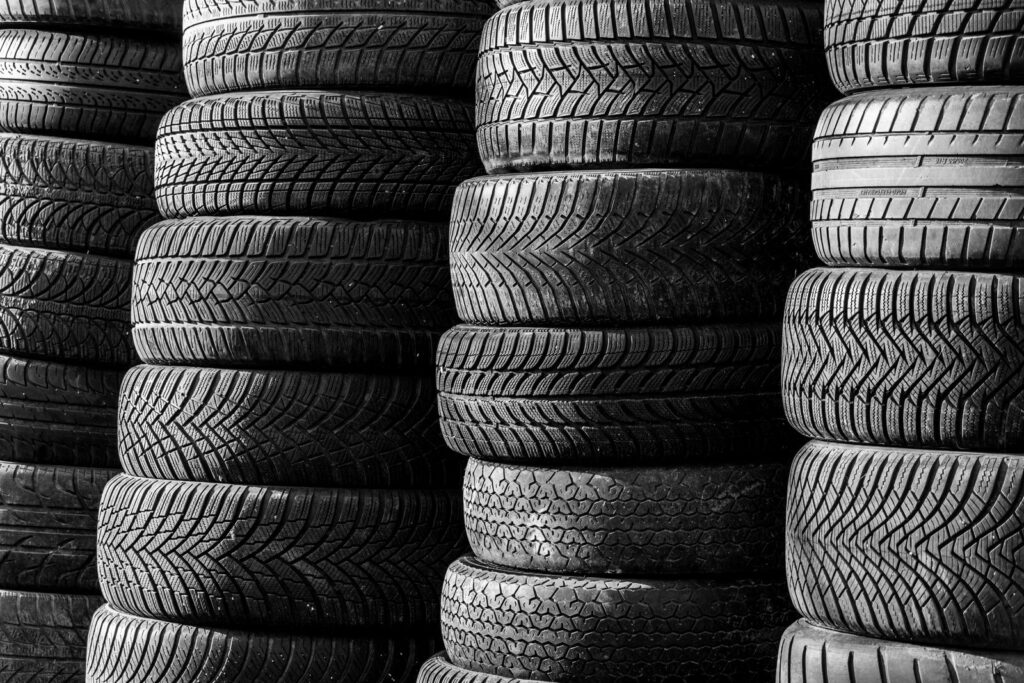Stacks of car tyres showing their tread patterns