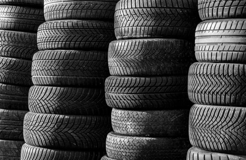 Stacks of car tyres showing their tread patterns