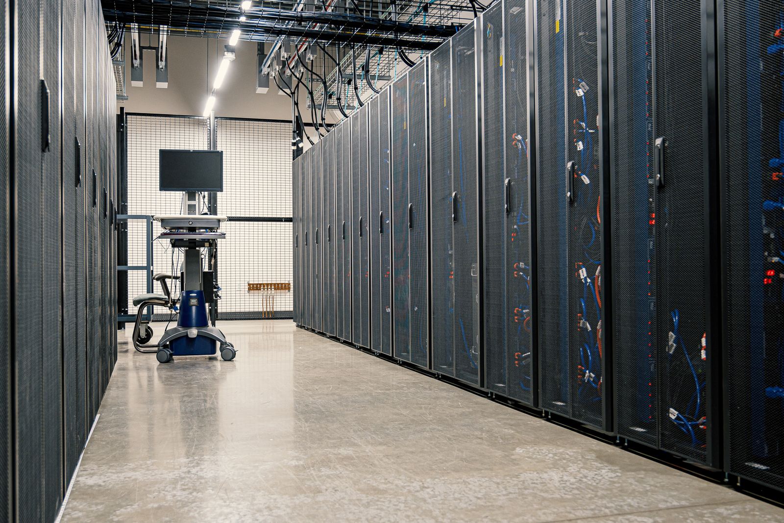 Aisle between rows of server cabinets in a data centre