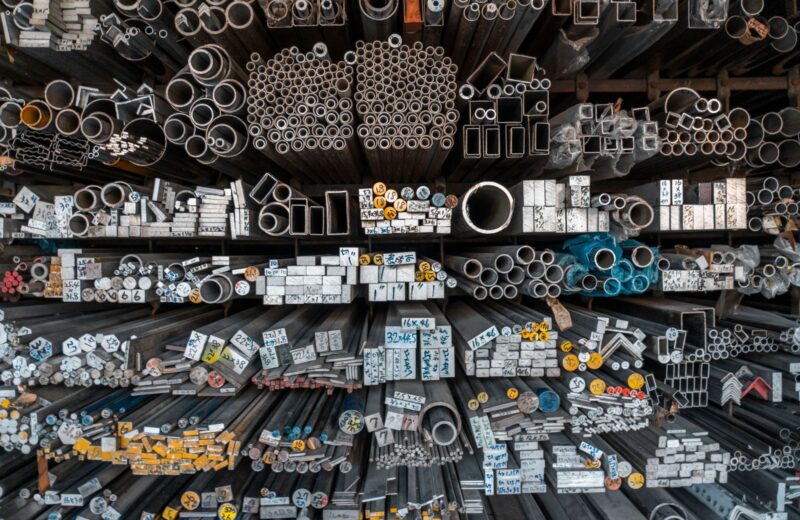 Racks of metal bars, tubes and profiles in a stockholder's warehouse
