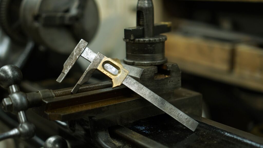 Vernier caliper resting on a machine in the workshop