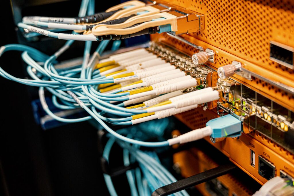 Patch cords plugged into the ports of a patch panel