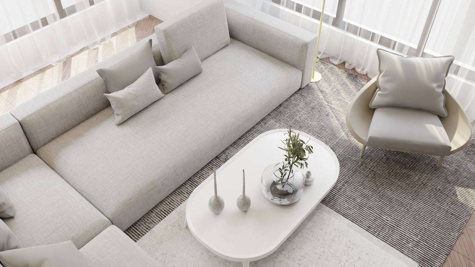 Pale living room with a low white sofa, a round coffee table and a striped rug