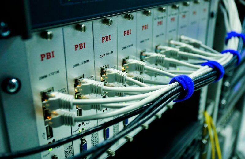 Network cables plugged into a switch panel in a data centre