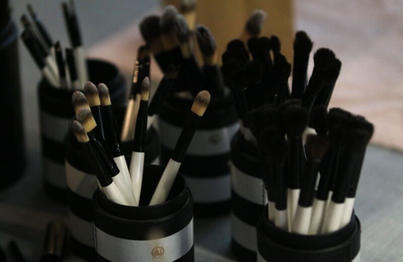 Clean makeup brushes arranged in holders