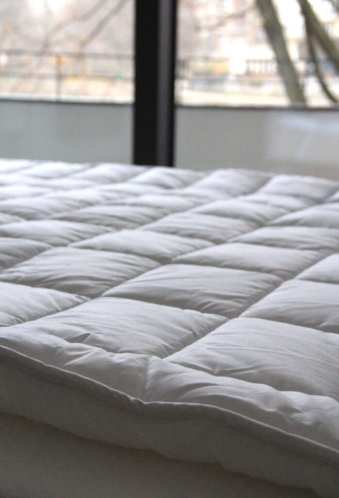 Close-up of a white quilted mattress top