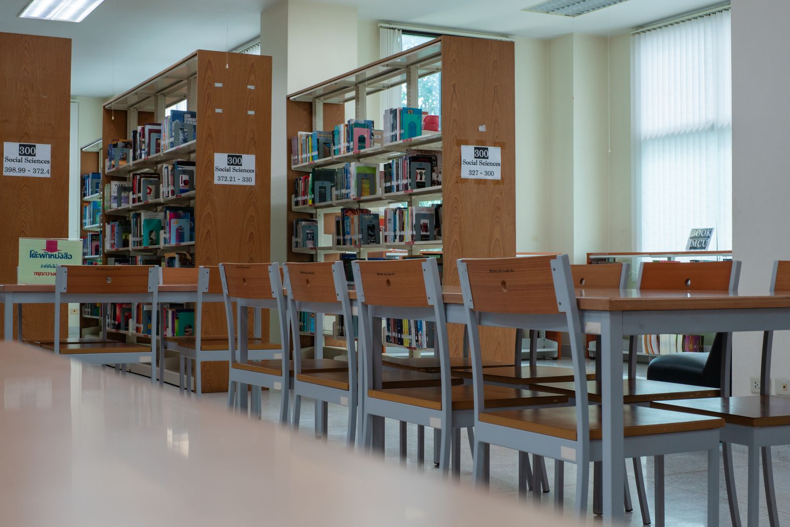 Library reading room with tables, chairs and shelves