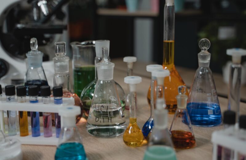 Coloured liquids in flasks and beakers on a lab bench