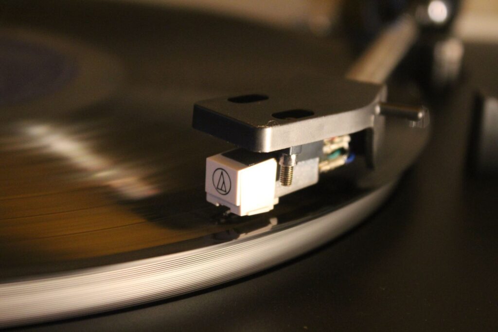 A turntable needle on a spinning record