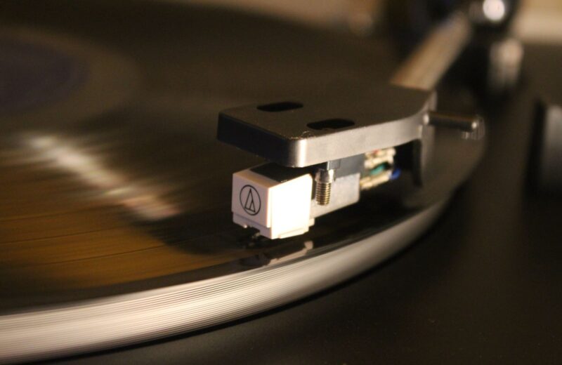 A turntable needle on a spinning record