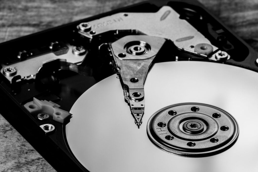 A black and white close-up of an opened hard drive
