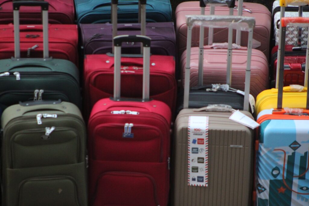 Suitcases of different colours stacked together