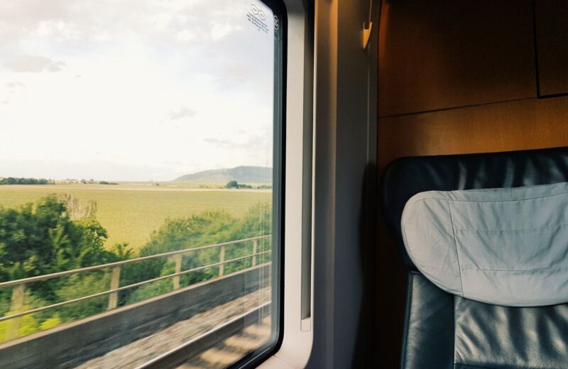 Green countryside seen from a train window