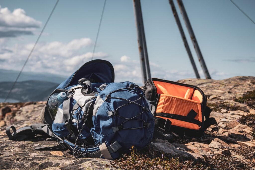 Two rucksacks resting on a rocky mountain top