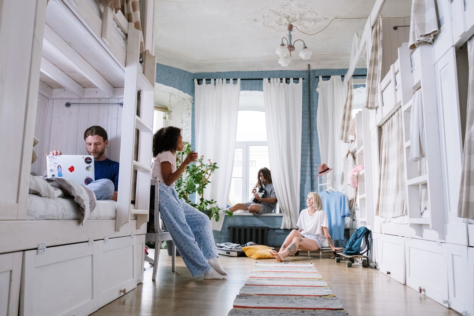Students relaxing in a bright shared room in halls