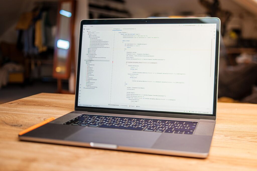 Open laptop on a wooden desk in a quiet office