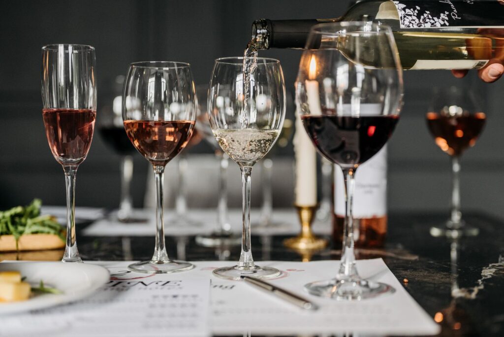 A tasting set with several glasses of red, white and rosé wine and a sheet of notes